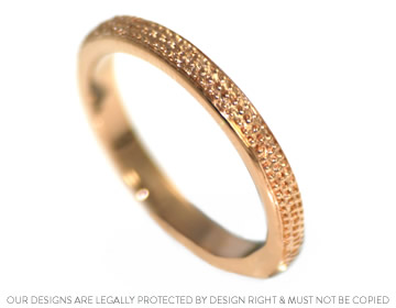 A bespoke handmade rose gold wedding ring with beaded detail