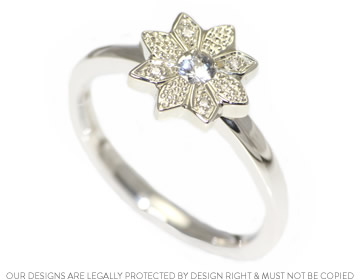 Natalie's petal engagement ring with a white sapphire