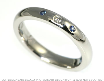 Diamond and blue sapphire engagement ring