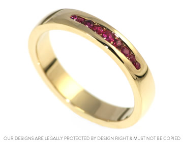 Carole's 18ct yellow gold eternity ring with rubies 