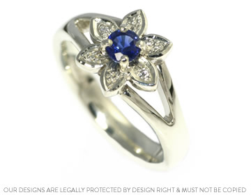 Flower inspired handmade engagement ring with a sapphire