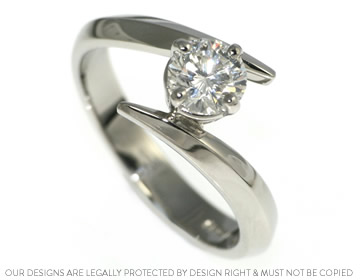 Jemma's engagement ring with their own 0.69ct H SI1 diamond  