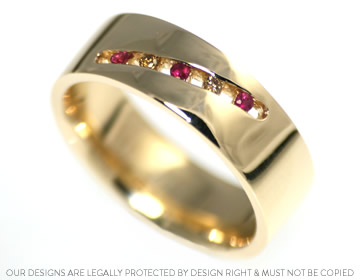 Faith's anniversary ring with rubies and cognac diamonds