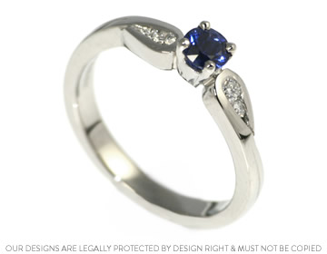 Charlotte's  engagement ring with a brilliant cut blue sapphire 