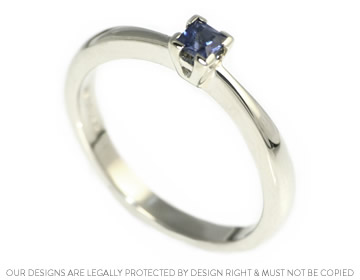 Katy's white gold engagement ring with a princess cut sapphire 