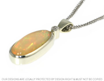 Striking freeform opal and diamond pendant