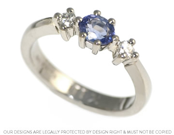 Mark wanted a oval cut sapphire and diamond trilogy engagement ring