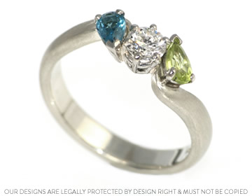 Gillian's beautiful diamond, peridot and topaz eternity ring