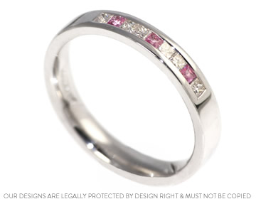 A bespoke white gold eternity ring with striking pink sapphires