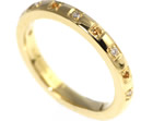 a handmade yellow gold eternity ring with citrines and diamonds