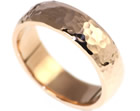 rose gold mens wedding ring with a polished and hammered finish