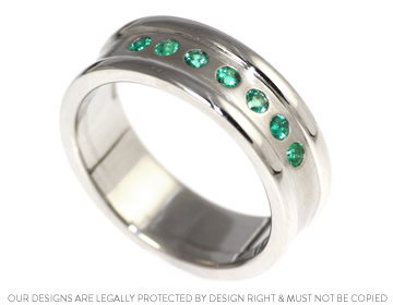 Stunning palladium and emerald wedding band