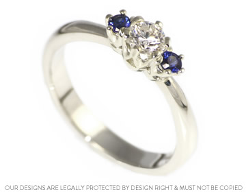 Classic diamond and sapphire trilogy engagement ring