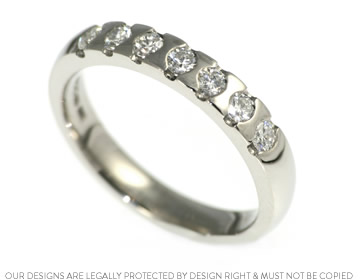 Stunning 0.60ct diamond and palladium eternity ring