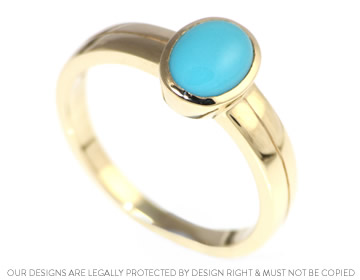 A striking yellow gold and turquoise dress ring