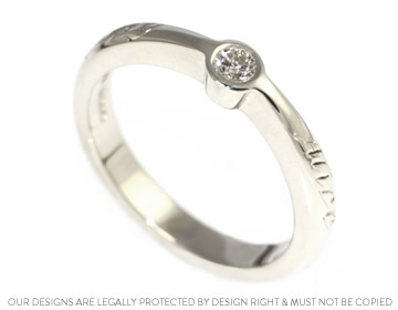 Contemporary diamond engagement ring with engraved writing