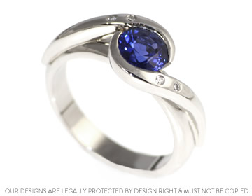 Platinum engagement ring with a stunning blue sapphire 