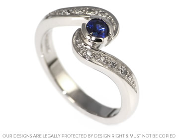 A beautiful palladium and blue sapphire engagement ring 