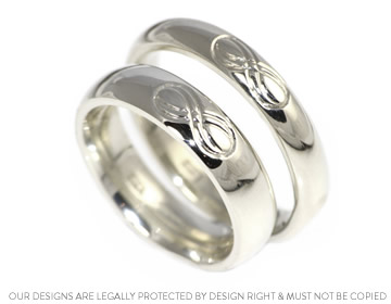 A stunning 'love knot' pair of wedding rings