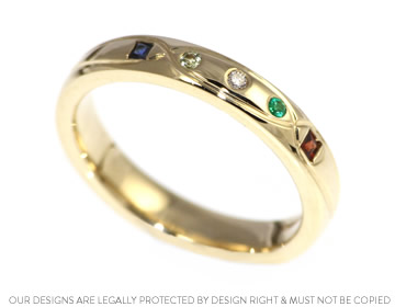 Kirsty's bespoke yellow gold and birthstone eternity ring