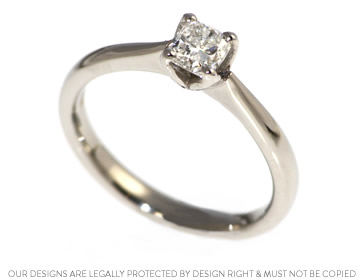 Charlotte's engagement ring with a cushion cut diamond 