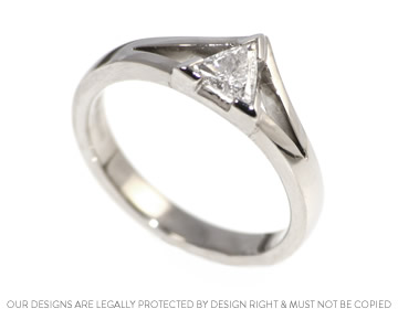 Dramatic trilliant engagement ring