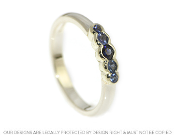 A delicate sapphire and 9ct white gold engagement ring.