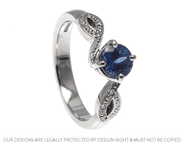 Sean proposed with a beautiful blue sapphire design