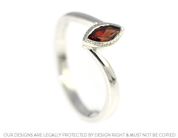 Lara's twist inspired marquise garnet ring