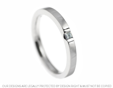 A contemporary palladium and diamond engagement ring