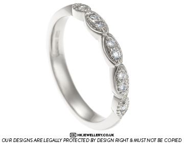 Unique diamond half eternity ring with marquise shaping 