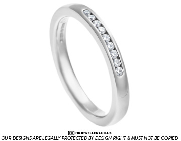 Delicate platinum and diamond channel set eternity ring