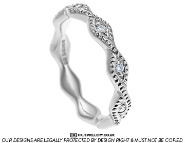 “Rippling water” inspired 0.068ct HSI diamond and 9 carat white gold eternity ring