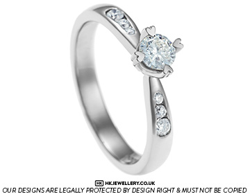 Palladium and diamond engagement ring with heart detailing