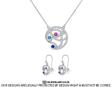 Claire's bespoke platinum diamond, sapphire and ruby pendant and earring set