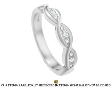 wave inspired eternity ring with brilliant cut diamonds