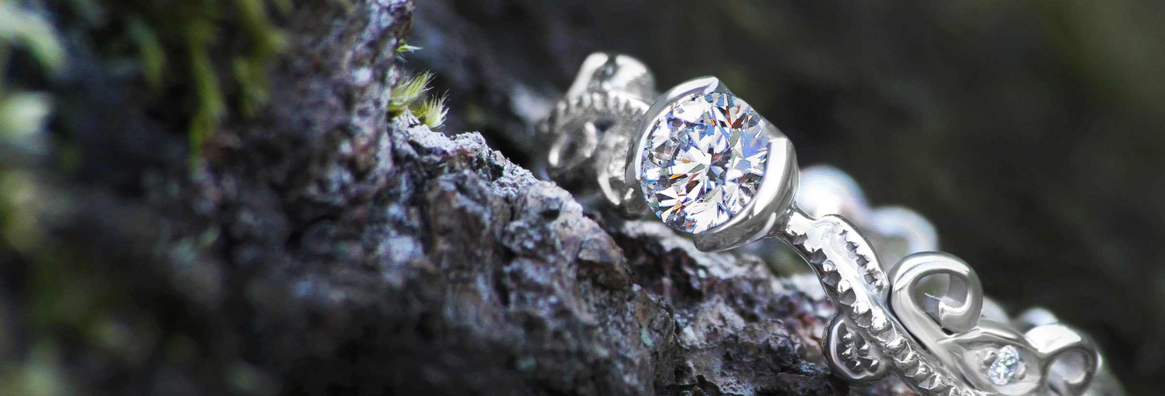 Vine inspired engagement ring with a stunning diamond