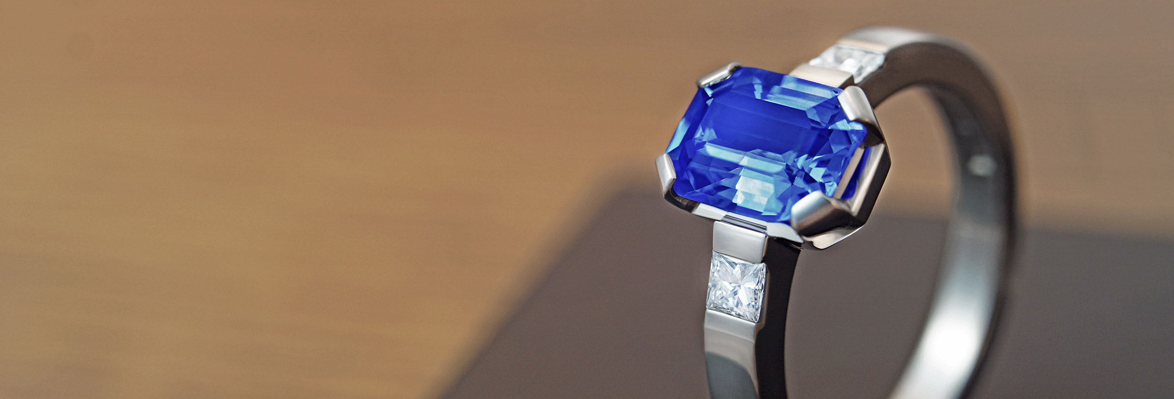 Stunning emerald cut blue sapphire and palladium engagement ring