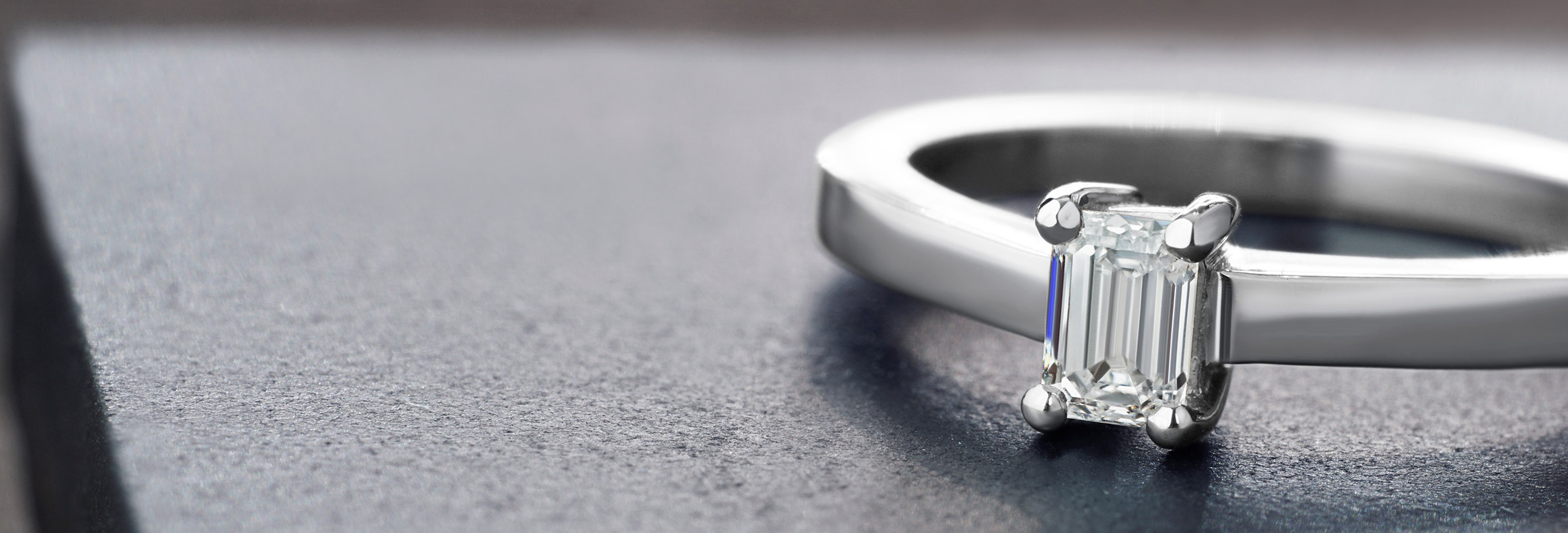 A delicate Art deco inspired palladium and diamond engagement ring