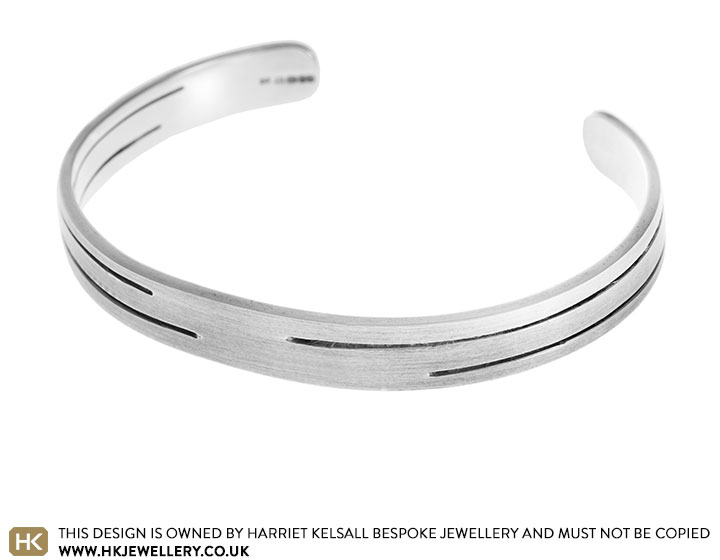 Sterling silver polished bangle inspired by industrial architecture