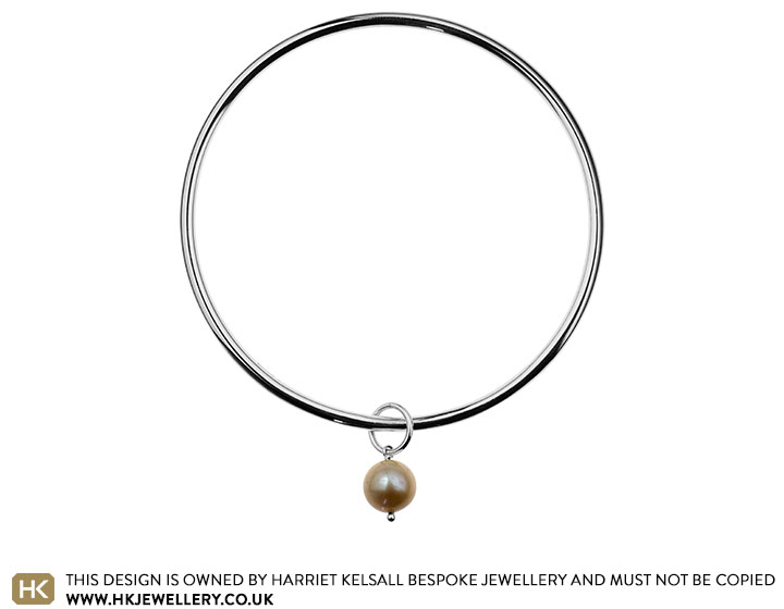 Sterling silver bangle with a round ivory pearl