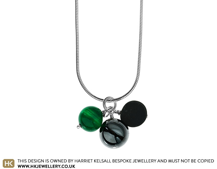 Green agate, hematite sphere and onyx disc cluster pendant