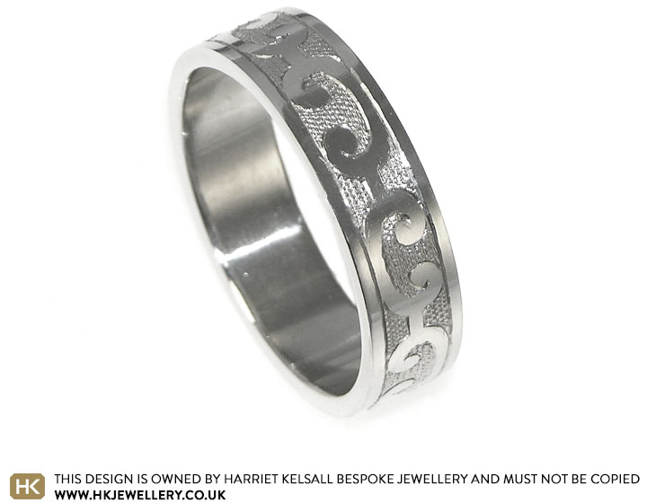 Platinum wedding ring with etch style hand engraved scrolls