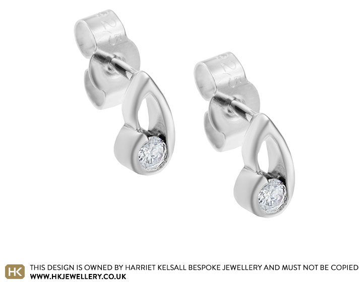 Sterling silver ribbon inspired 0.14ct diamond earrings