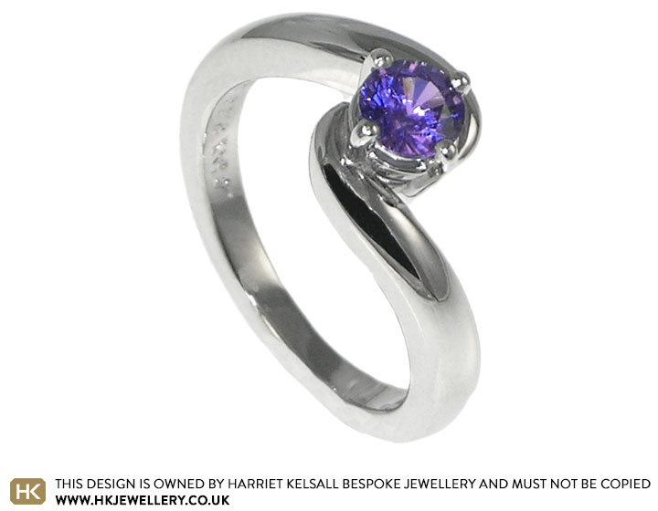 Sasha's platinum engagement ring with a purple amethyst