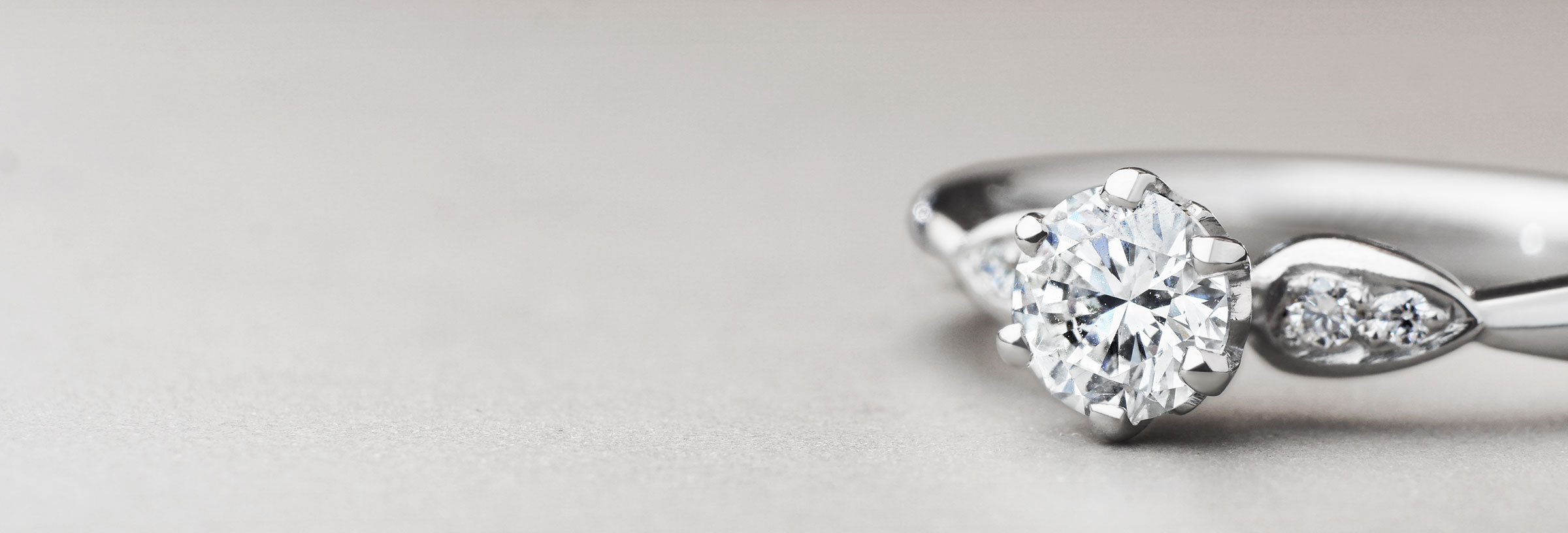 Floral inspired palladium and 0.56ct diamond engagement ring