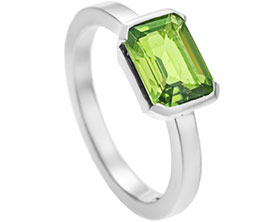 13162-palladium-and-peridot-dress-ring-with-end-only-setting-and-a-polished-finish_1.jpg