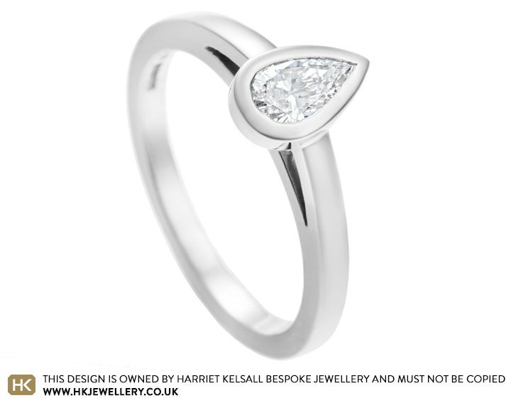 Emma's palladium and 0.38ct pear cut diamond engagement ring