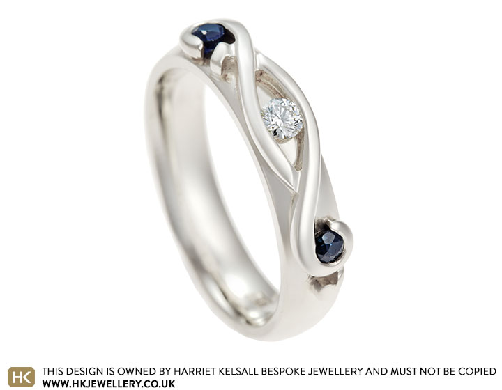 Treble clef inspired 9 carat white gold, sapphire and diamond engagement ring