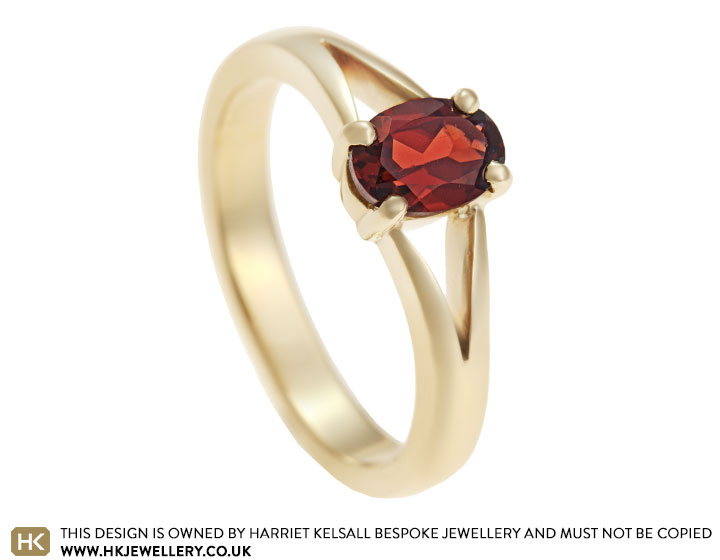 Linda's oval cut garnet and 9 carat yellow gold dress ring